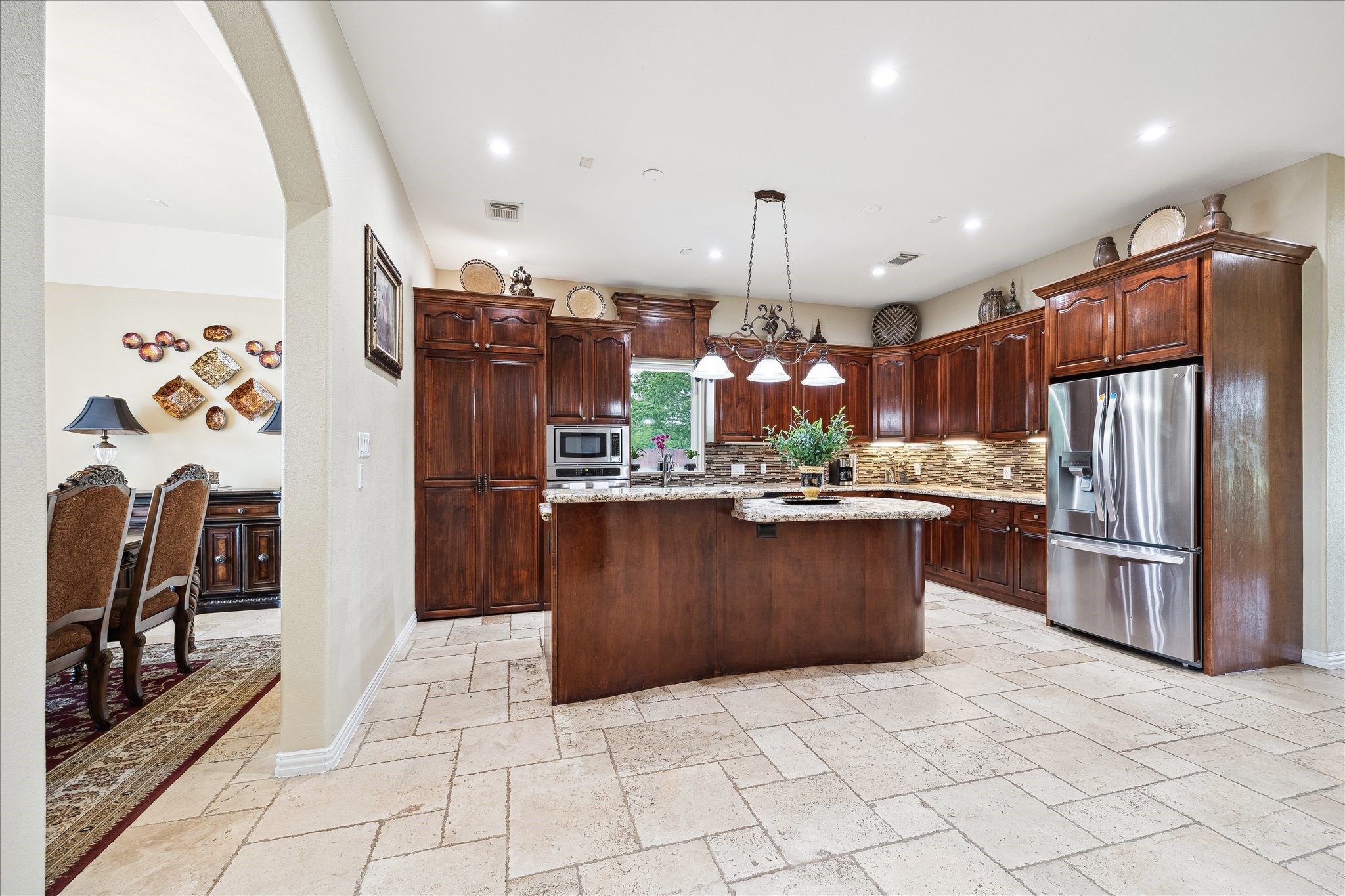8917 Hawk Road Pearland, TX 77584 - Photo 9 of 33 a kitchen with stainless steel appliances granite countertop a refrigerator a sink a stove a oven and a refrigerator
