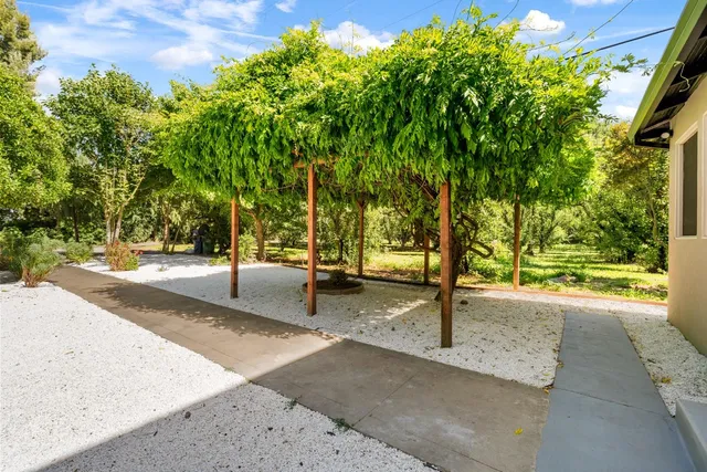 a bedroom with a bed and a television