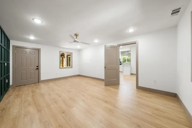 a kitchen with a sink and a large window