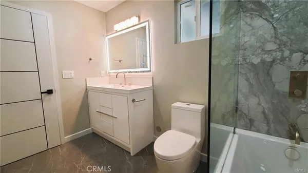 an empty room with a wooden closet