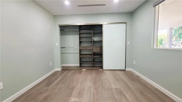 a view of a pathway with a wrought fence