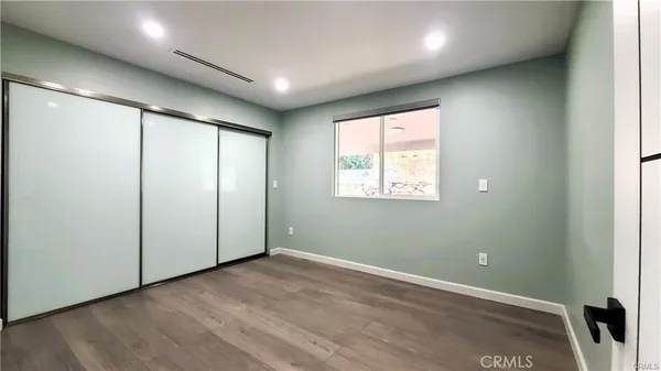 a view of house with yard outdoor seating and lake view