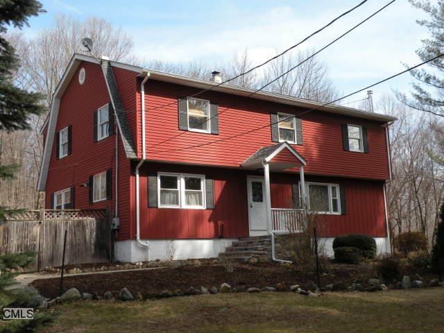 96 Castle Hill Road Newtown, CT 06470 - Photo 1 of 1 a front view of a house with a yard