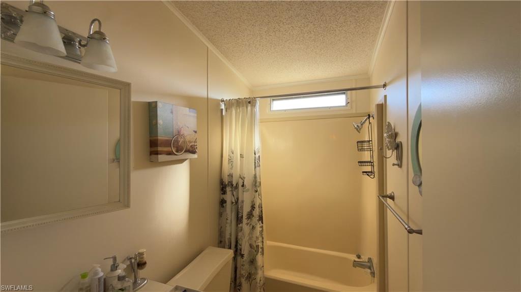 207 Riverwood Road Naples, FL 34114 - Photo 13 of 13 a bathroom with a shower and a glass door