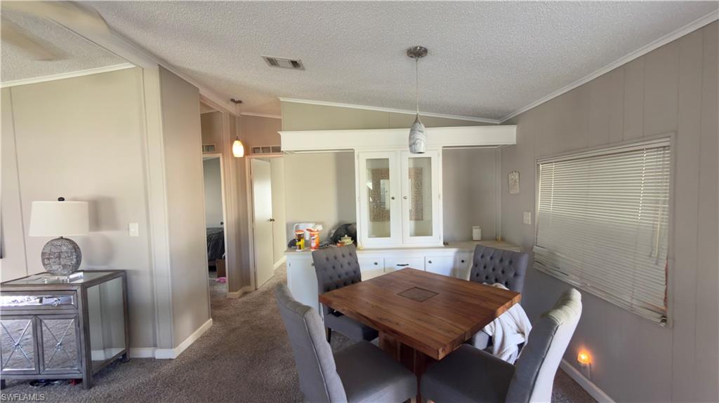 207 Riverwood Road Naples, FL 34114 - Photo 7 of 13 a living room with furniture and a window