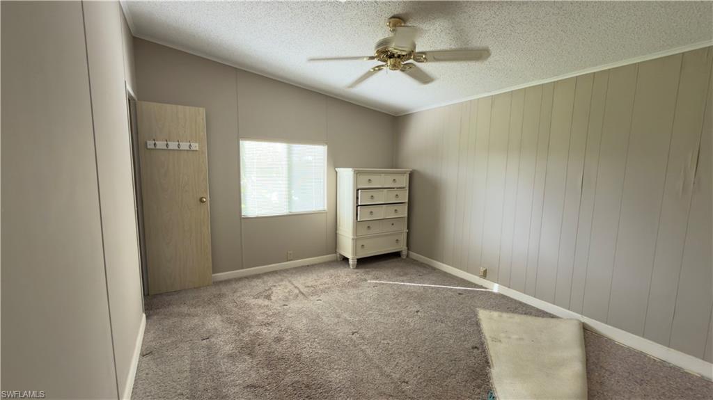 207 Riverwood Road Naples, FL 34114 - Photo 10 of 13 a view of an empty room with a window