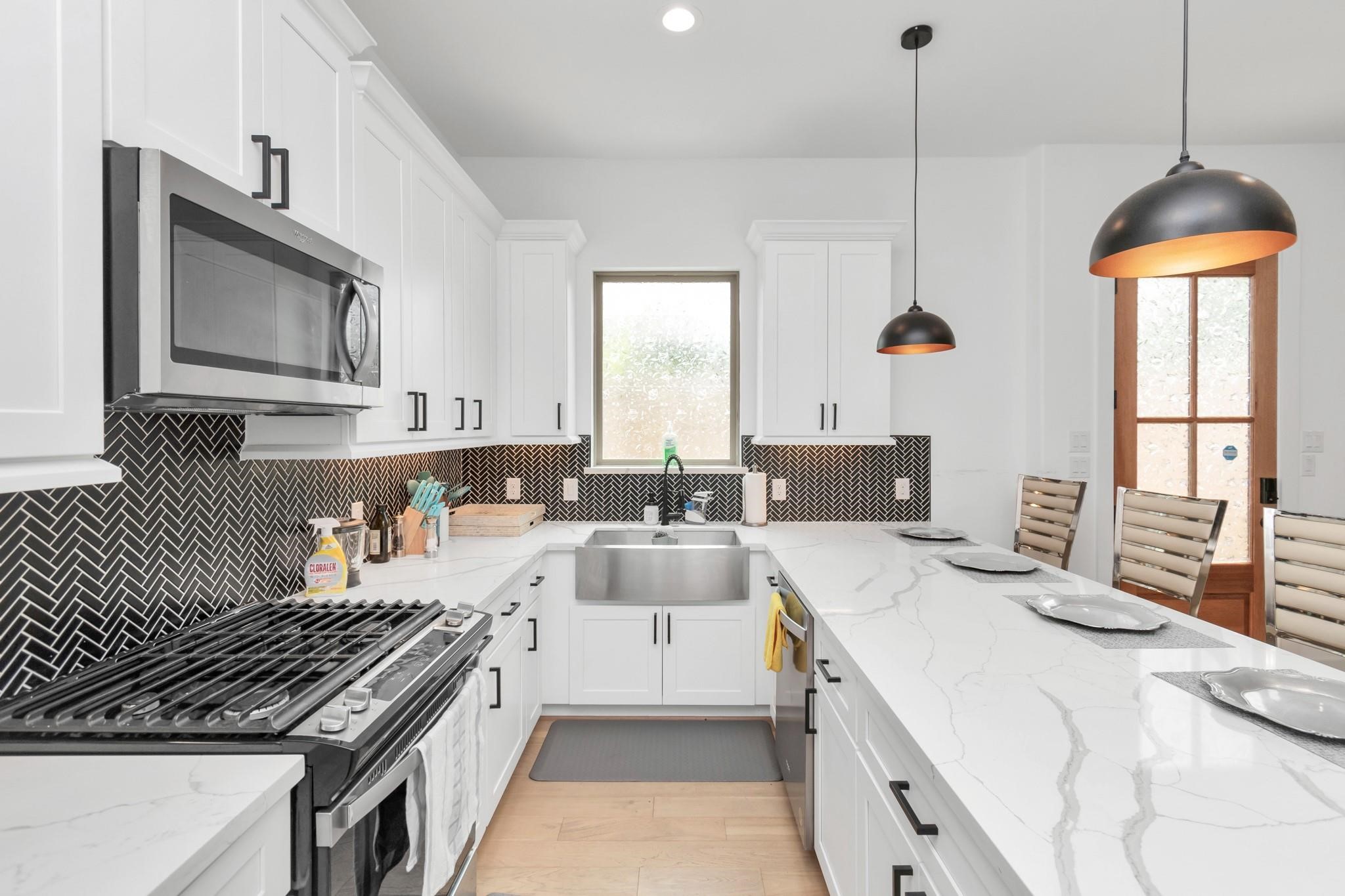 3306 Live Oak Street Houston, TX 77004 - Photo 6 of 10 a kitchen with stove a sink and cabinets