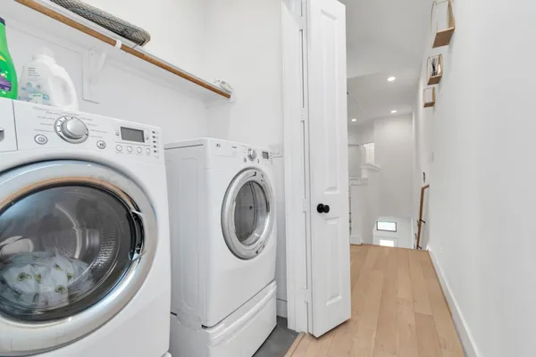 a view of a hallway with washer and dryer