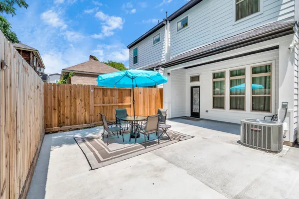 a view of a house with patio and wooden floor