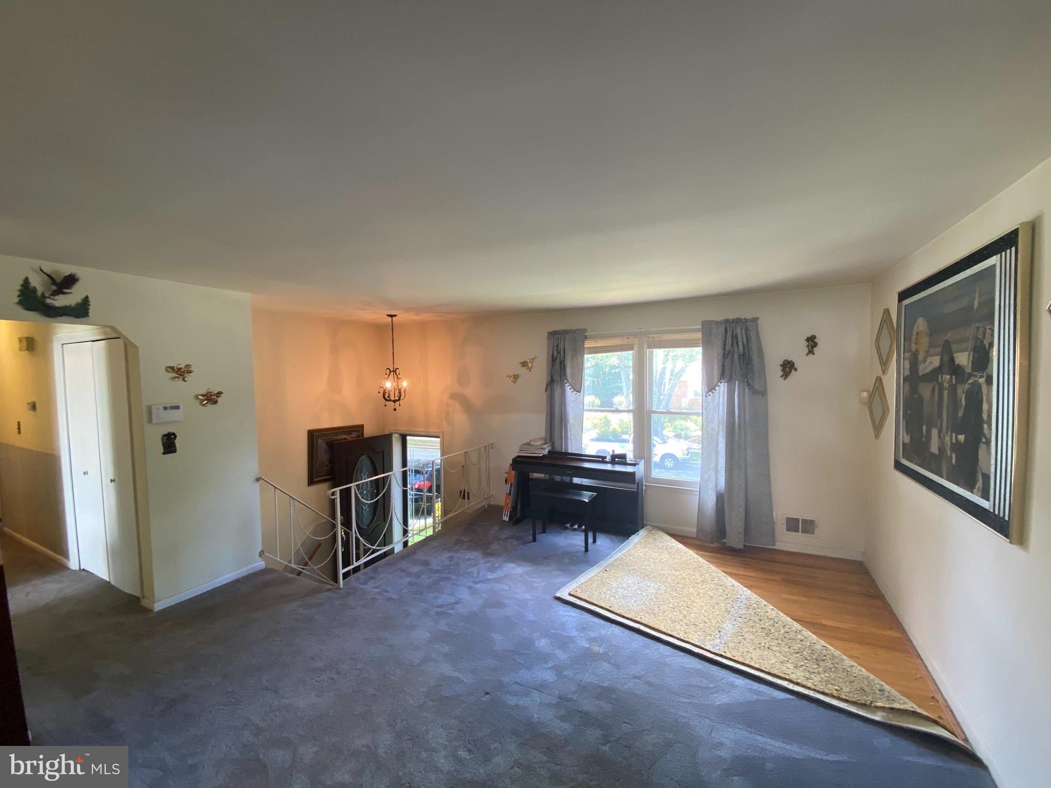 6102 Spell Road Clinton, MD 20735 - Photo 9 of 34 Living Room with Immaculate Hardwood Floors