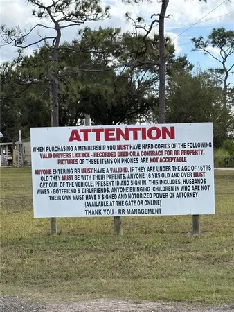 a wooden floor and trees in the background