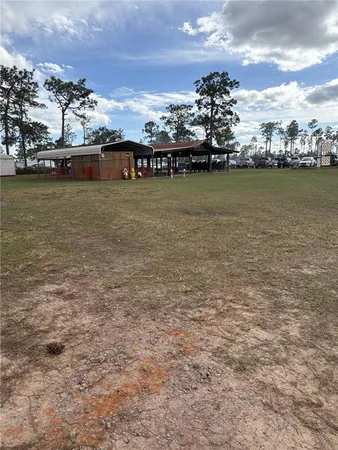 a view of a water with boats and trees in the background