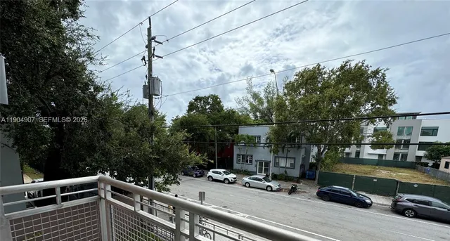 a view of a street with cars