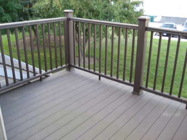 a view of a balcony with wooden floor