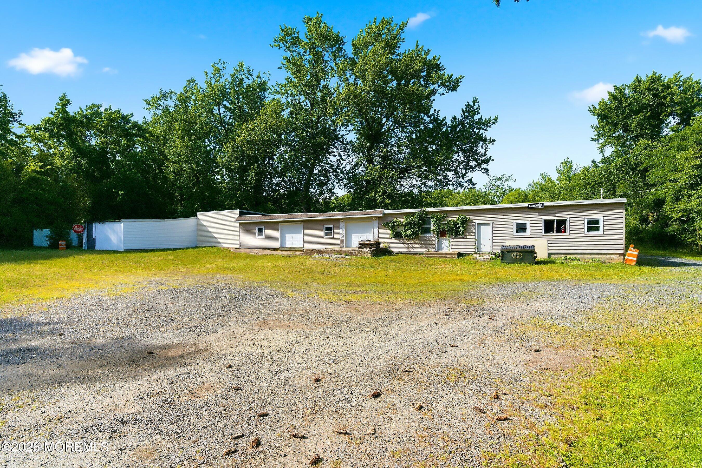 26 Megill Road Farmingdale, NJ 07727 - Photo 14 of 16 a view of a swimming pool with a outdoor seating