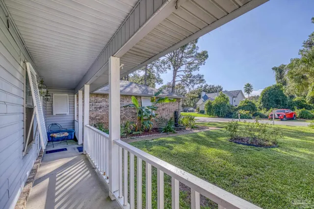 a view of a porch and garden
