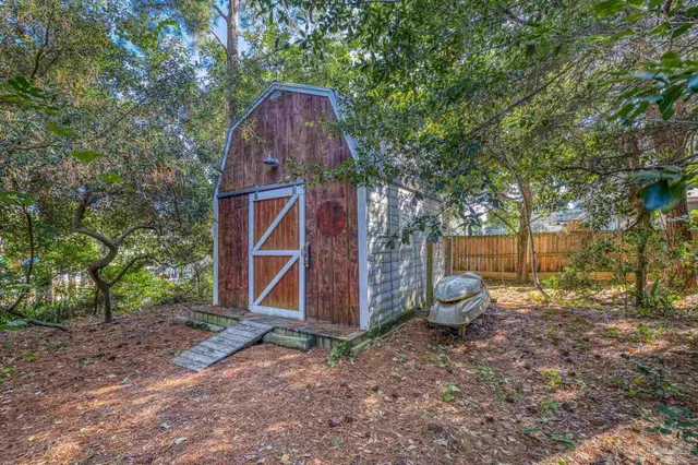 a backyard of a house with portable swimming pool and outdoor seating