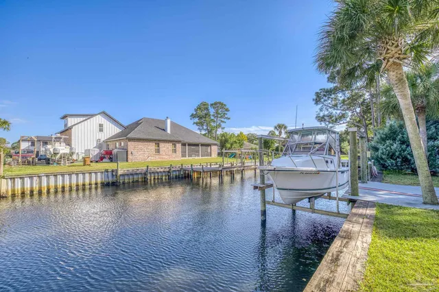 a view of house with swimming pool yard and outdoor seating