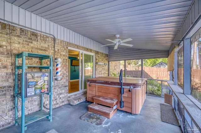 a bedroom with furniture and large windows