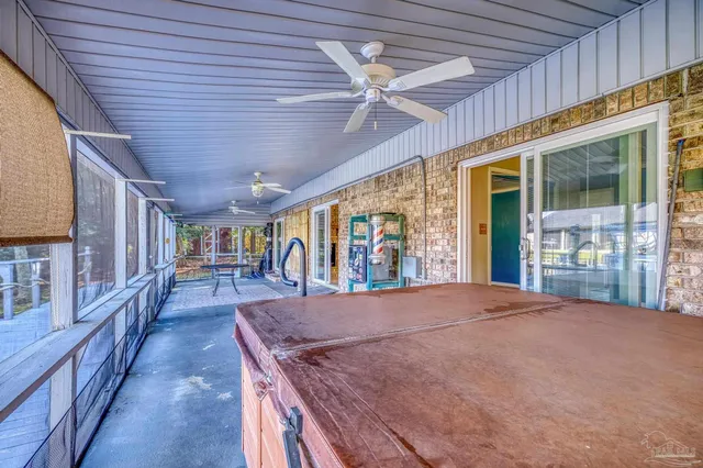 a view of a porch with furniture and a window