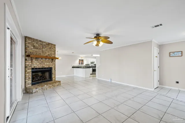 a view of kitchen with microwave and cabinets