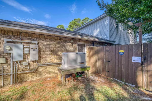a front view of a house with outdoor seating
