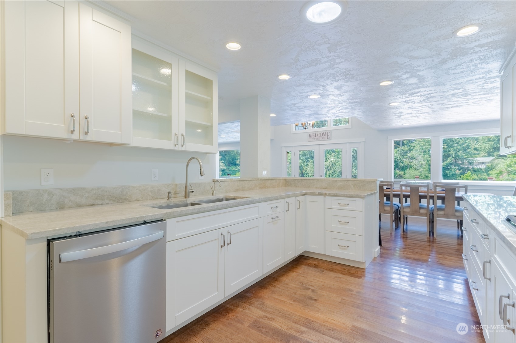 4110 Thornton Road Southeast Olympia, WA 98513 - Photo 15 of 40 a kitchen with sink cabinets and wooden floor