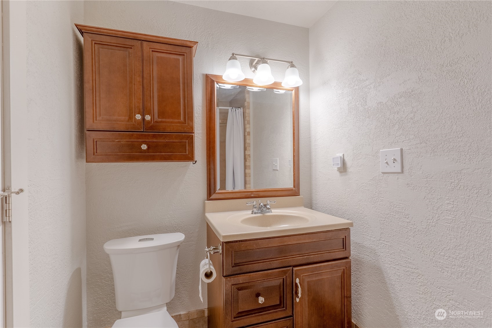 4110 Thornton Road Southeast Olympia, WA 98513 - Photo 21 of 40 a bathroom with a sink a toilet and mirror