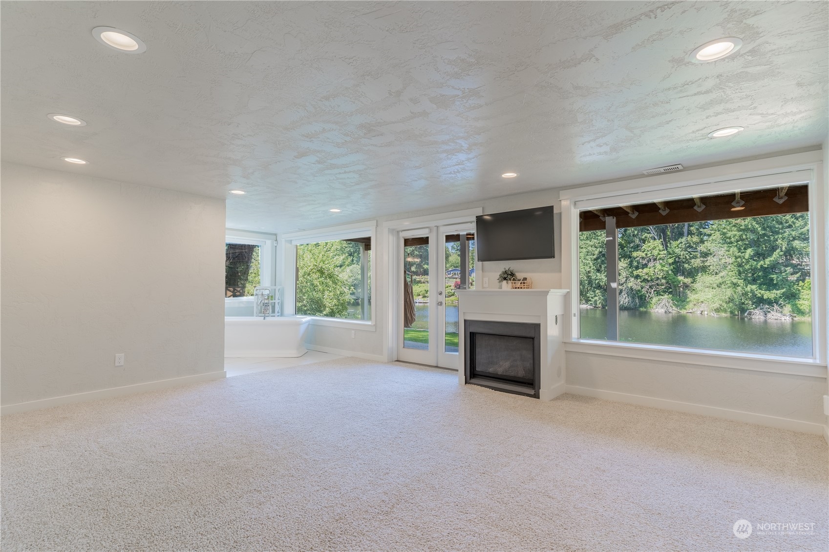 4110 Thornton Road Southeast Olympia, WA 98513 - Photo 28 of 40 a view of a livingroom with a fireplace window and an empty room