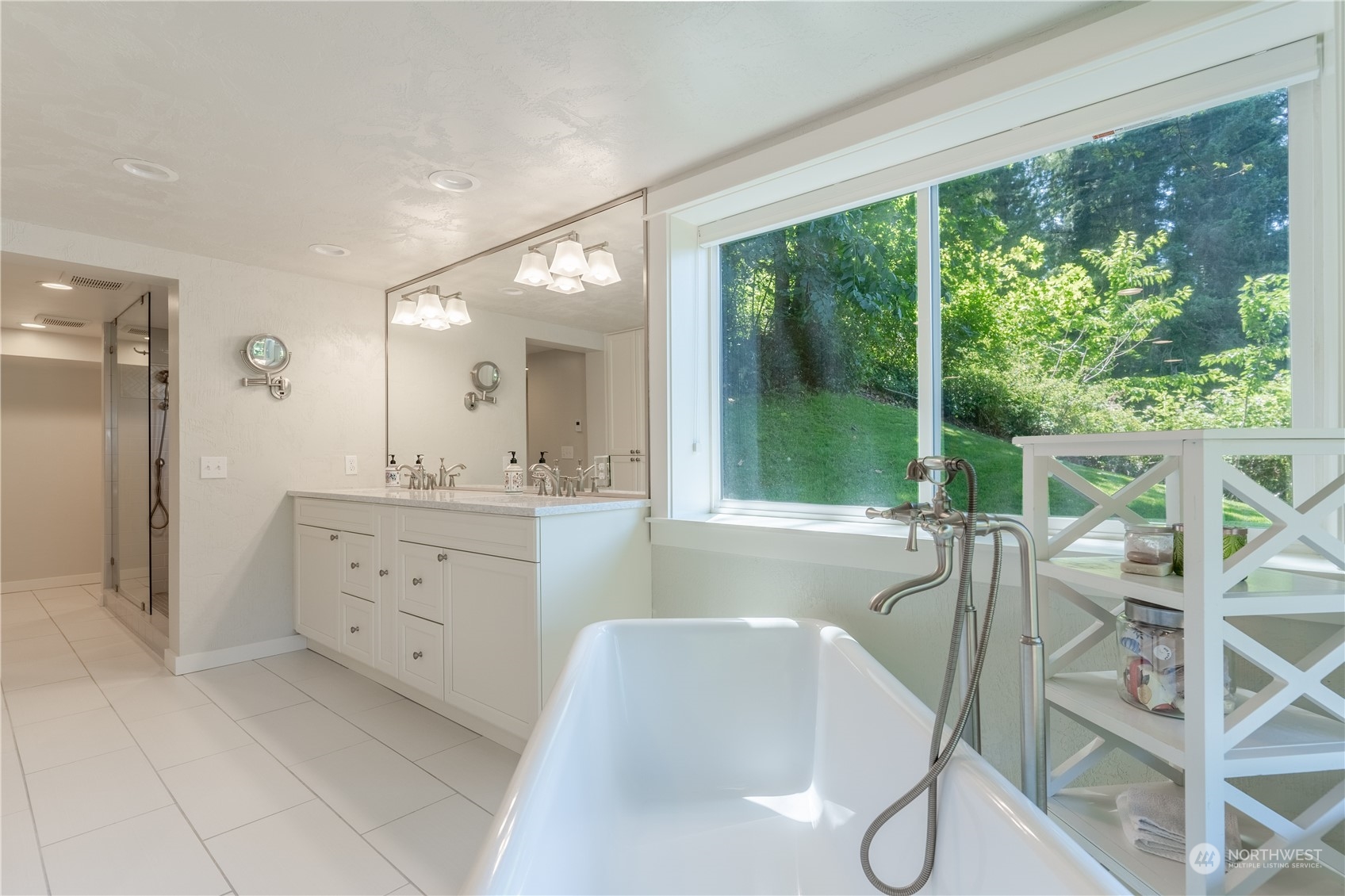 4110 Thornton Road Southeast Olympia, WA 98513 - Photo 30 of 40 a spacious bathroom with a granite countertop sink mirror and a large window
