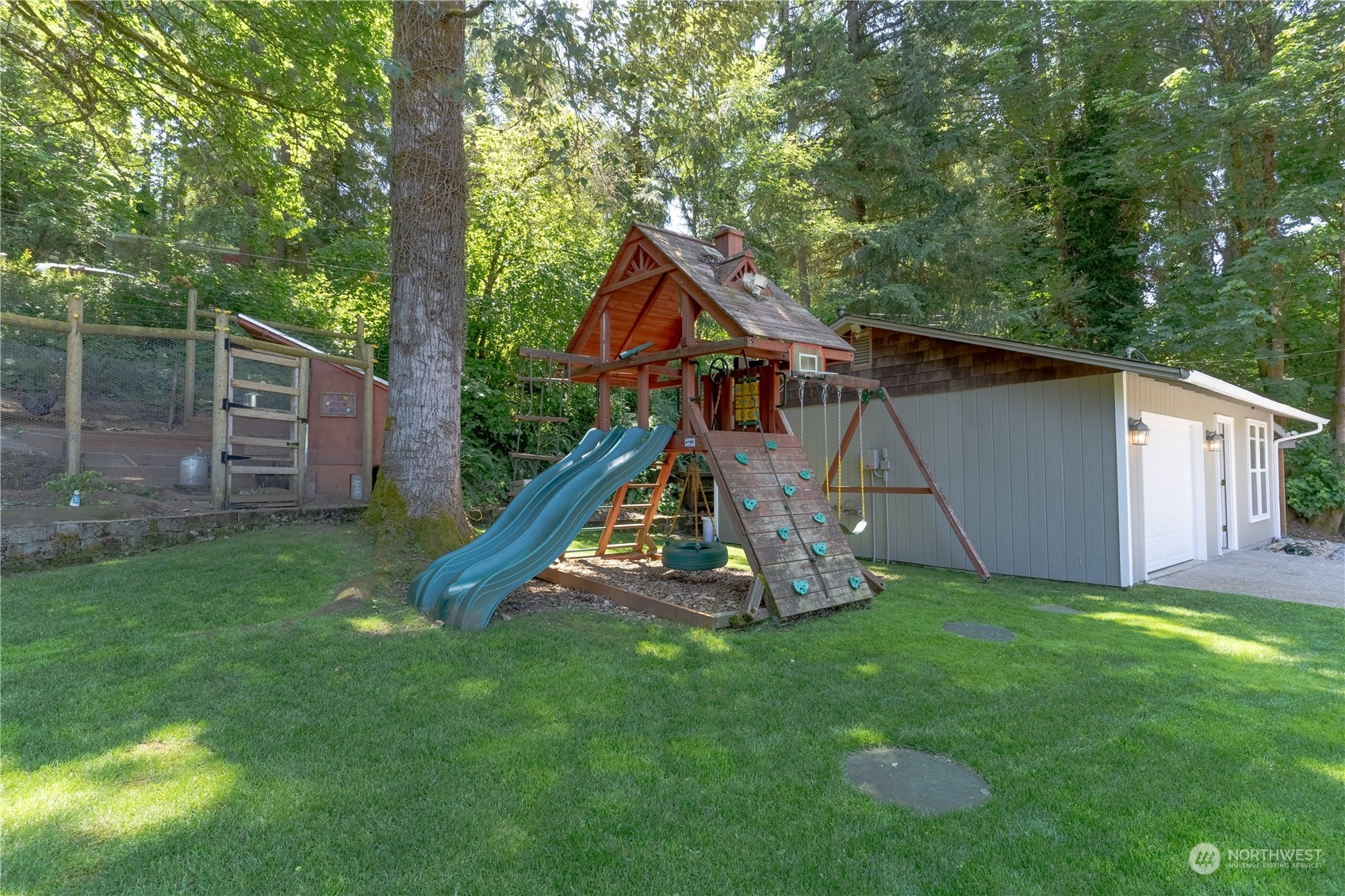 4110 Thornton Road Southeast Olympia, WA 98513 - Photo 39 of 40 a view of a house with backyard and a slide