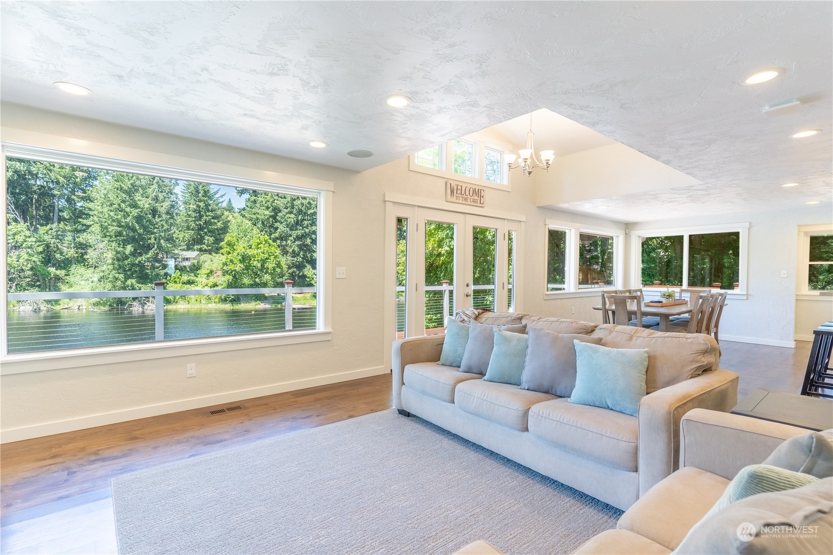 4110 Thornton Road Southeast Olympia, WA 98513 - Photo 10 of 40 a living room with furniture and floor to ceiling windows