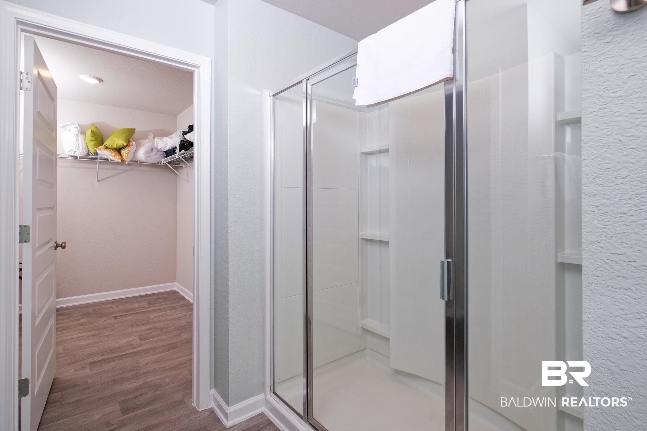 7425 Coppin Drive Foley, AL 36535 - Photo 20 of 41 Bathroom with hardwood / wood-style floors and a shower with shower door