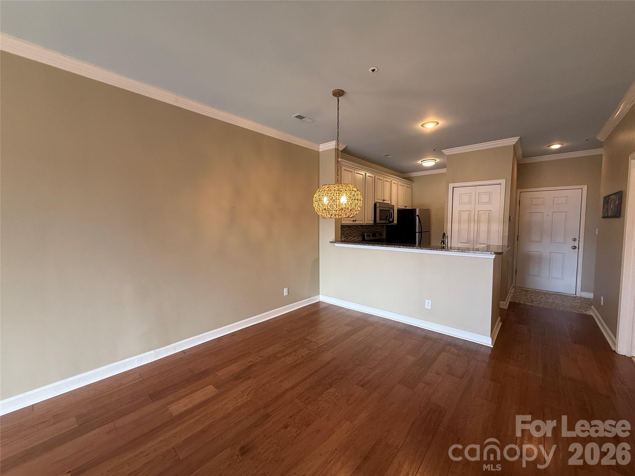 18009 Kings Point Drive, Unit M Cornelius, NC 28031 - Photo 14 of 34 a view of a kitchen with a sink and a refrigerator