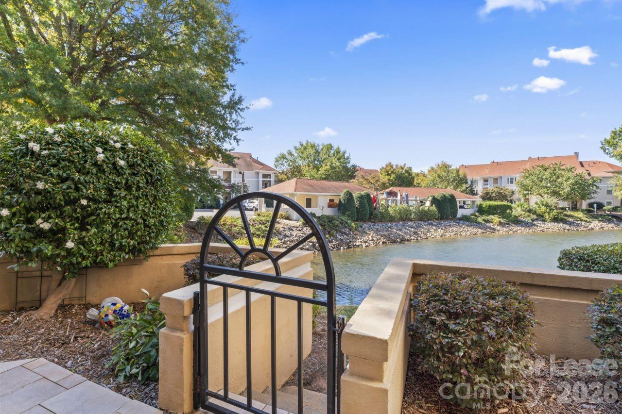 18009 Kings Point Drive, Unit M Cornelius, NC 28031 - Photo 28 of 34 a view of a balcony with wooden floor