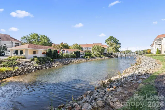 a view of a lake with a building in the background