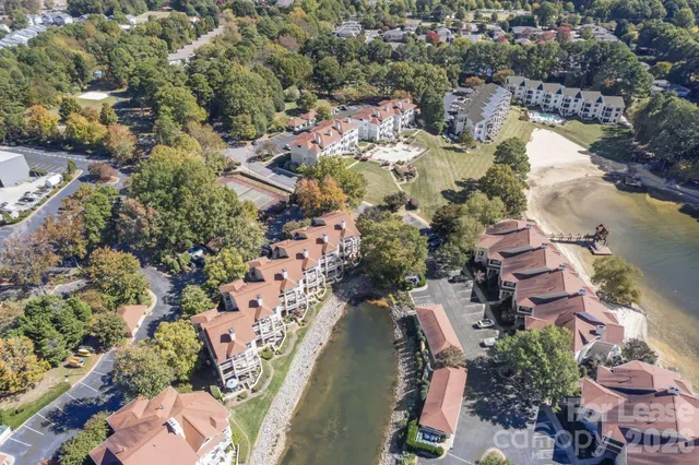 an aerial view of a houses with ocean view