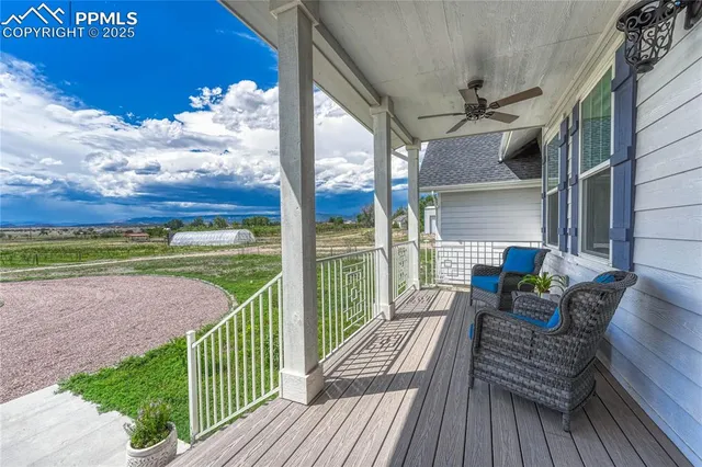 a view of a balcony with wooden floor