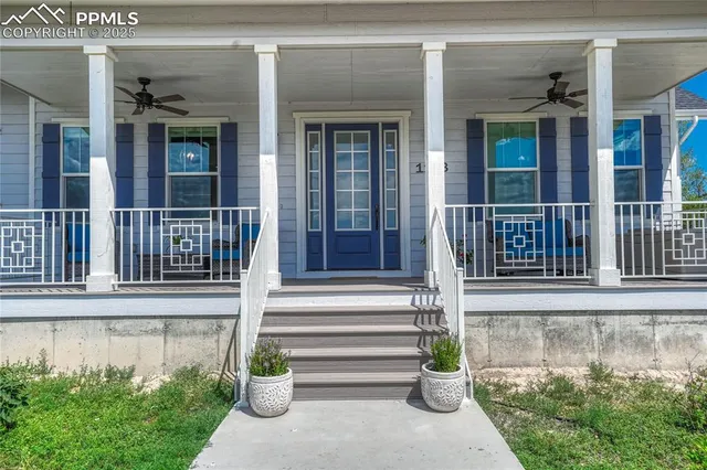 front view of a house with a potted plant