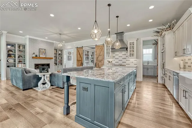 a kitchen with stainless steel appliances granite countertop wooden cabinets and stove