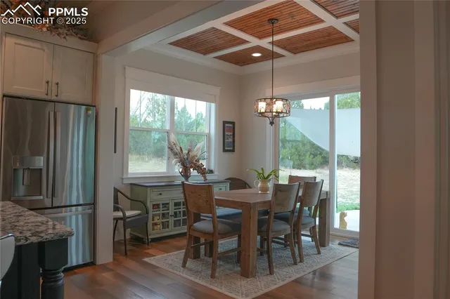 a view of a dining room with furniture window and outside view