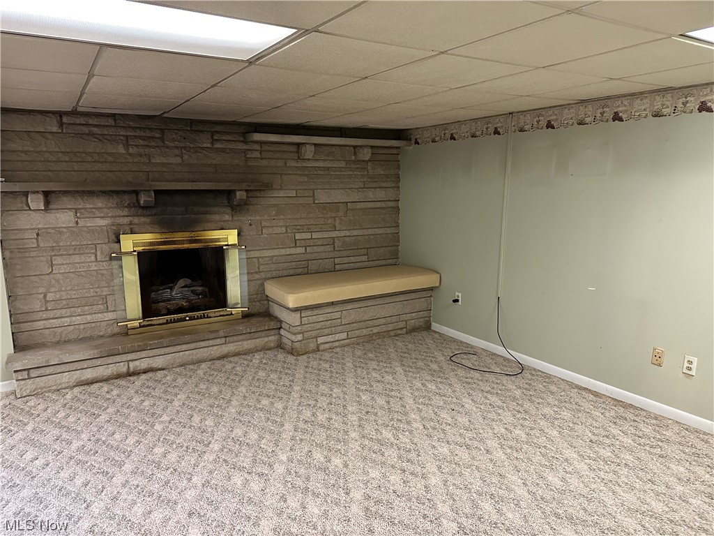 62273 Tacoma Road Barnesville, OH 43713 - Photo 27 of 34 Carpeted living room with a fireplace and a drop ceiling