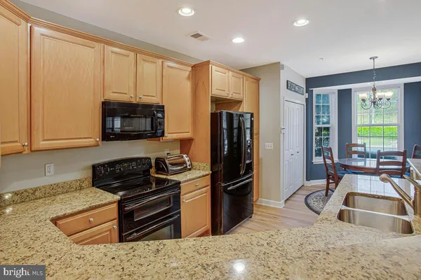 an empty room with closet and fan