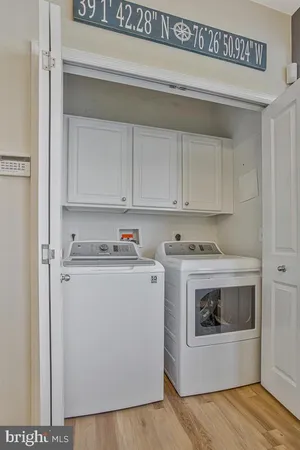 a city street lined with buildings and cars parked in front of it