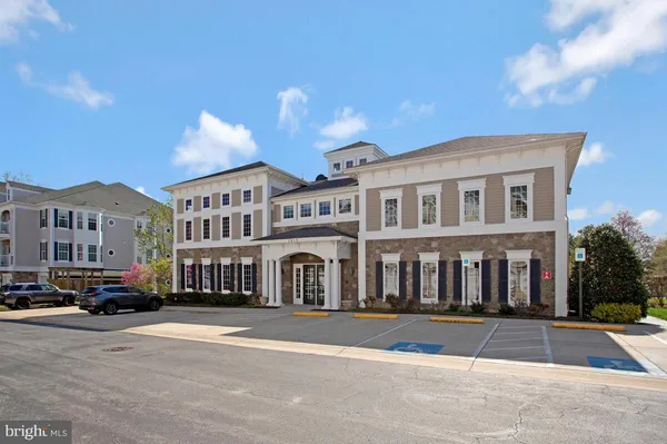 a very nice looking living room with dining room and wooden floor