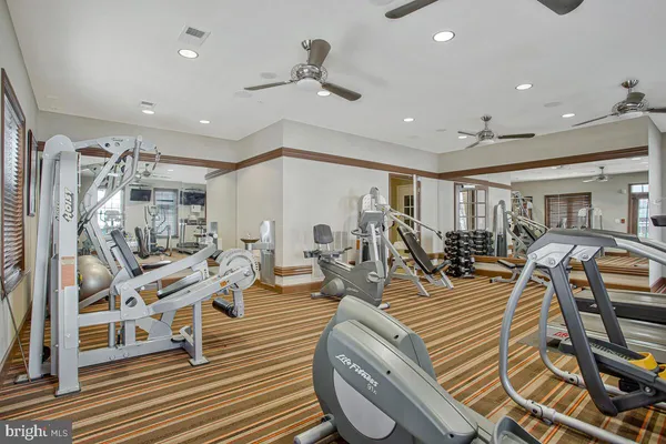 a view of a workspace with bookshelf