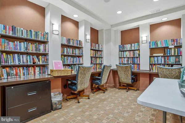 a large kitchen with a table and chairs