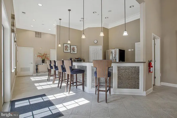 a living room with fireplace furniture and a chandelier