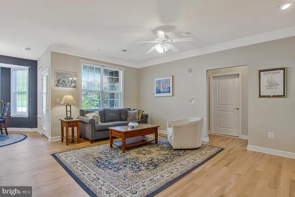 a view of a dining room with furniture and a window