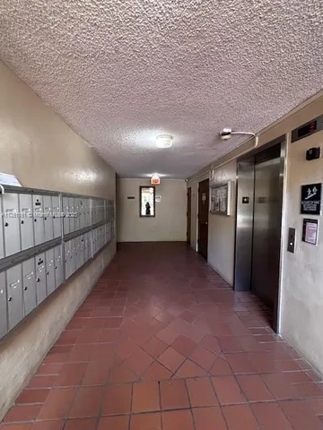 a kitchen with a stove and a refrigerator